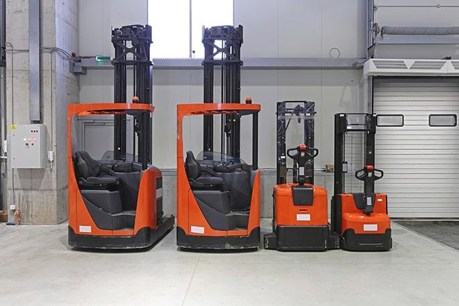 forklifts maneuvering in a construction site